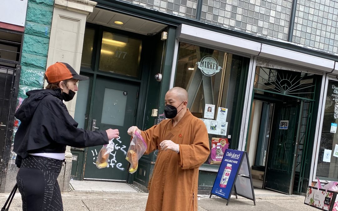 Renyin, the Year of Tiger, Buddha’s Birthday, Master Shi Xing Wu of Xing Wu Zen Temple Society in Canada distributes food on the street to form a good relationship with all living beings.